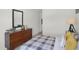 Bedroom featuring wood dresser with airplane model and plaid bedding with yellow pillows at 3104 Glasgow Pl, Danville, IN 46122