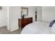 Bright bedroom boasts a modern dresser with decorative accents and opens to a closet at 3104 Glasgow Pl, Danville, IN 46122