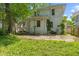 View of the home's backyard with a concrete patio and grassy area at 3134 N College Ave, Indianapolis, IN 46205