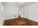 A bright bedroom features hardwood floors, a closet, and a window for natural light at 3134 N College Ave, Indianapolis, IN 46205