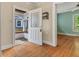 A welcoming entry with hardwood floors leading to a view of the living room at 3134 N College Ave, Indianapolis, IN 46205