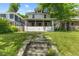 Charming two-story home with a welcoming front porch and well-maintained lawn at 3134 N College Ave, Indianapolis, IN 46205