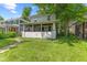 Charming home with a covered front porch and well-manicured lawn at 3134 N College Ave, Indianapolis, IN 46205