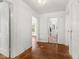 Hallway with hardwood floors leads to the bathroom at 3134 N College Ave, Indianapolis, IN 46205