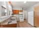 The kitchen features ample natural light, a standard appliance package and warm cabinets at 3134 N College Ave, Indianapolis, IN 46205