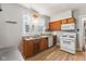 Bright kitchen with classic cabinets, a microwave, and essential appliances at 3134 N College Ave, Indianapolis, IN 46205