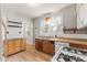 Vintage kitchen with wood cabinets and dishwasher needs some TLC at 3134 N College Ave, Indianapolis, IN 46205