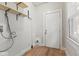Utility room with wood floor features shelving and a door to the exterior at 3134 N College Ave, Indianapolis, IN 46205