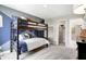 Stylish room featuring a bunk bed and a unique geometric accent wall at 3200 Glasgow Pl, Danville, IN 46122