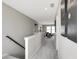 Bright hallway featuring gray walls, white trim, leading to living room and bedrooms at 3200 Glasgow Pl, Danville, IN 46122