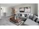 Comfortable living room featuring a gray sectional, stylish decor, and plenty of natural light at 3200 Glasgow Pl, Danville, IN 46122