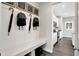 Mudroom with a built-in bench, coat hooks, and decor with convenient access to the kitchen at 3200 Glasgow Pl, Danville, IN 46122