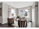 Inviting sitting room with neutral walls, three large windows, and comfortable seating with natural light at 3200 Glasgow Pl, Danville, IN 46122