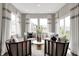 Bright sitting area with four armchairs, plush pillows and three windows providing ample natural light at 3200 Glasgow Pl, Danville, IN 46122