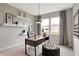 Well-lit study showcasing a desk with open shelves and a comfortable office space at 3200 Glasgow Pl, Danville, IN 46122