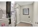 Well-lit utility room featuring tile floors and modern equipment including a water heater and air conditioning system at 3200 Glasgow Pl, Danville, IN 46122