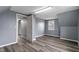 An interior bedroom shot shows neutral paint and wood-look floors at 3305 N Arlington Ave, Indianapolis, IN 46218