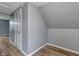 A cozy bedroom features wood-look flooring and a neutral color palette at 3305 N Arlington Ave, Indianapolis, IN 46218