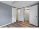 Bedroom with grey walls, white trim, and modern wood-look flooring at 3305 N Arlington Ave, Indianapolis, IN 46218