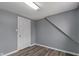 An interior shot of a bedroom featuring wood-look flooring and neutral paint at 3305 N Arlington Ave, Indianapolis, IN 46218