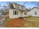 Charming two-story home with siding, green shutters, and fall foliage at 3305 N Arlington Ave, Indianapolis, IN 46218