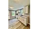 Bright kitchen featuring white cabinets, granite countertops, and new floors at 3305 N Arlington Ave, Indianapolis, IN 46218