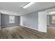 Spacious living room with grey walls and modern wood-look flooring at 3305 N Arlington Ave, Indianapolis, IN 46218