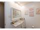 Stylish bathroom with marble countertop, modern sink, vanity and decorative wall art at 3514 Summerfield Dr, Indianapolis, IN 46214