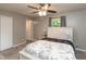 Cozy bedroom featuring a ceiling fan, closet, and a comfortable bed with a Paris-themed comforter at 3514 Summerfield Dr, Indianapolis, IN 46214