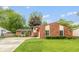 Charming front exterior showcasing a well-manicured lawn and brick facade, with a basketball hoop on the side at 3514 Summerfield Dr, Indianapolis, IN 46214