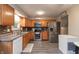 Spacious kitchen features stainless steel appliances, ample counter space, and stylish gray floors at 3514 Summerfield Dr, Indianapolis, IN 46214