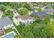 An aerial shot highlights the backyard with a patio set, lush lawn, and surrounding mature trees, offering great privacy at 3655 Copperleaf Blvd, Greenwood, IN 46143