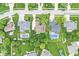 An aerial view displays the property amongst other neighborhood homes, showcasing community pools and mature greenery at 3655 Copperleaf Blvd, Greenwood, IN 46143
