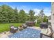 Inviting backyard patio with hot tub, grill, and outdoor seating perfect for relaxing and entertaining at 3655 Copperleaf Blvd, Greenwood, IN 46143