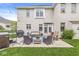 Backyard patio with hot tub, grill, and outdoor seating area with access to the home through sliding glass doors at 3655 Copperleaf Blvd, Greenwood, IN 46143