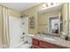 Guest bathroom with shower and bathtub combo plus granite countertops on the vanity at 3655 Copperleaf Blvd, Greenwood, IN 46143