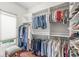 Walk-in closet includes shelving and hanging rods for organizing clothes and shoes at 3655 Copperleaf Blvd, Greenwood, IN 46143