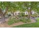 Picturesque home exterior showcasing lovely landscaping with mature trees and tasteful plantings at 3655 Copperleaf Blvd, Greenwood, IN 46143