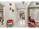 Inviting hallway with tiled floor, decorative art, and views into the living room with a fireplace at 3655 Copperleaf Blvd, Greenwood, IN 46143