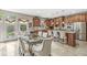 Eat-in kitchen area with custom cabinets, stainless appliances, bar seating, and modern decor at 3655 Copperleaf Blvd, Greenwood, IN 46143