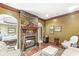 Comfortable living room with a stone fireplace and charming decor at 3655 Copperleaf Blvd, Greenwood, IN 46143