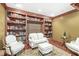 Cozy living room featuring custom built-in bookshelves and comfortable seating area at 3655 Copperleaf Blvd, Greenwood, IN 46143