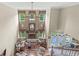 View from above of the living room showcasing its tall windows, fireplace, and seating area at 3655 Copperleaf Blvd, Greenwood, IN 46143