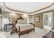 Spacious main bedroom with tray ceilings, soft lighting, and elegant furnishings at 3655 Copperleaf Blvd, Greenwood, IN 46143
