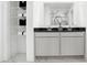 Elegant bathroom with double vanity, marble floors, and open shelving for storage at 3671 Pinnacle Dr, Bargersville, IN 46106