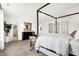 Spacious main bedroom with a four-poster bed, seating area, and serene decor offering a peaceful retreat at 3671 Pinnacle Dr, Bargersville, IN 46106