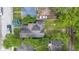 An aerial view showcases the home in the neighborhood with the backyard and roof at 401 Harlan St, Indianapolis, IN 46201