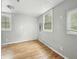 Bedroom with hardwood floors and windows providing natural light at 401 Harlan St, Indianapolis, IN 46201