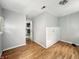 Bedroom featuring hardwood floors and a view into an adjacent room at 401 Harlan St, Indianapolis, IN 46201