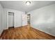 Bedroom with hardwood floors and a view of the kitchen through the door at 401 Harlan St, Indianapolis, IN 46201